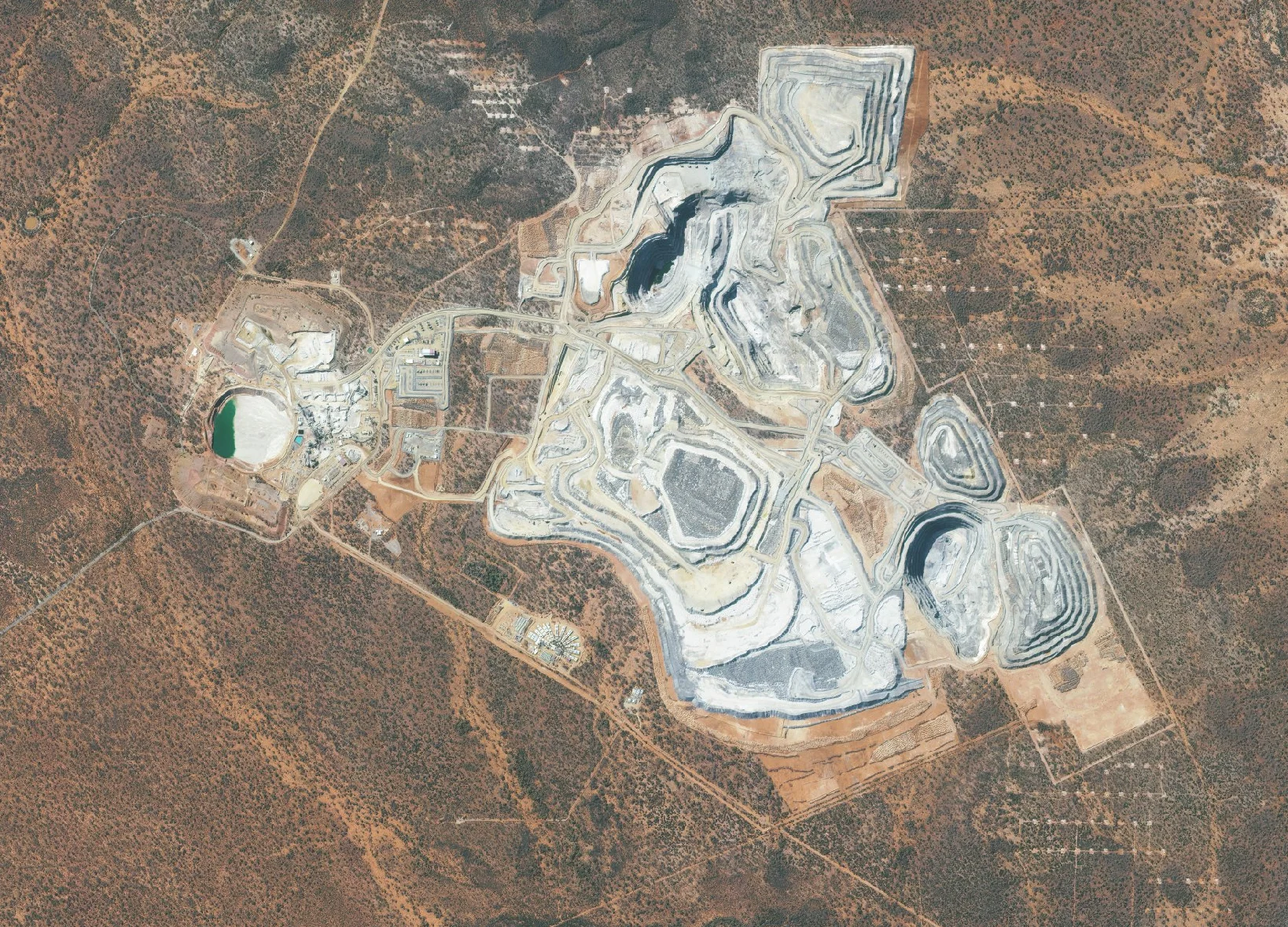 Custom satellite mosaic of an open-pit mine, processing plant and surrounding bushland