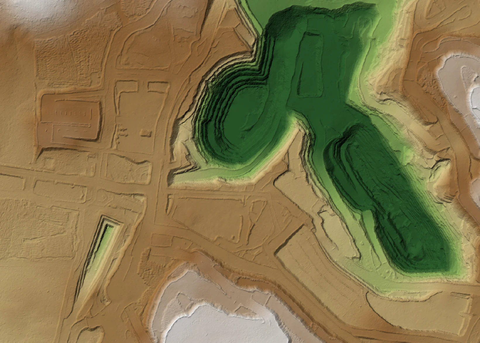Colour-shaded elevation model of open pits and surrounding haul roads