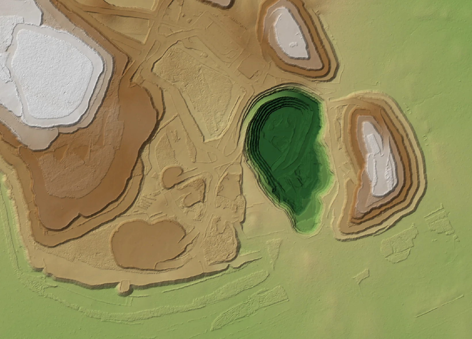 Colour-shaded elevation model of stockpiles, a pit and site infrastructure