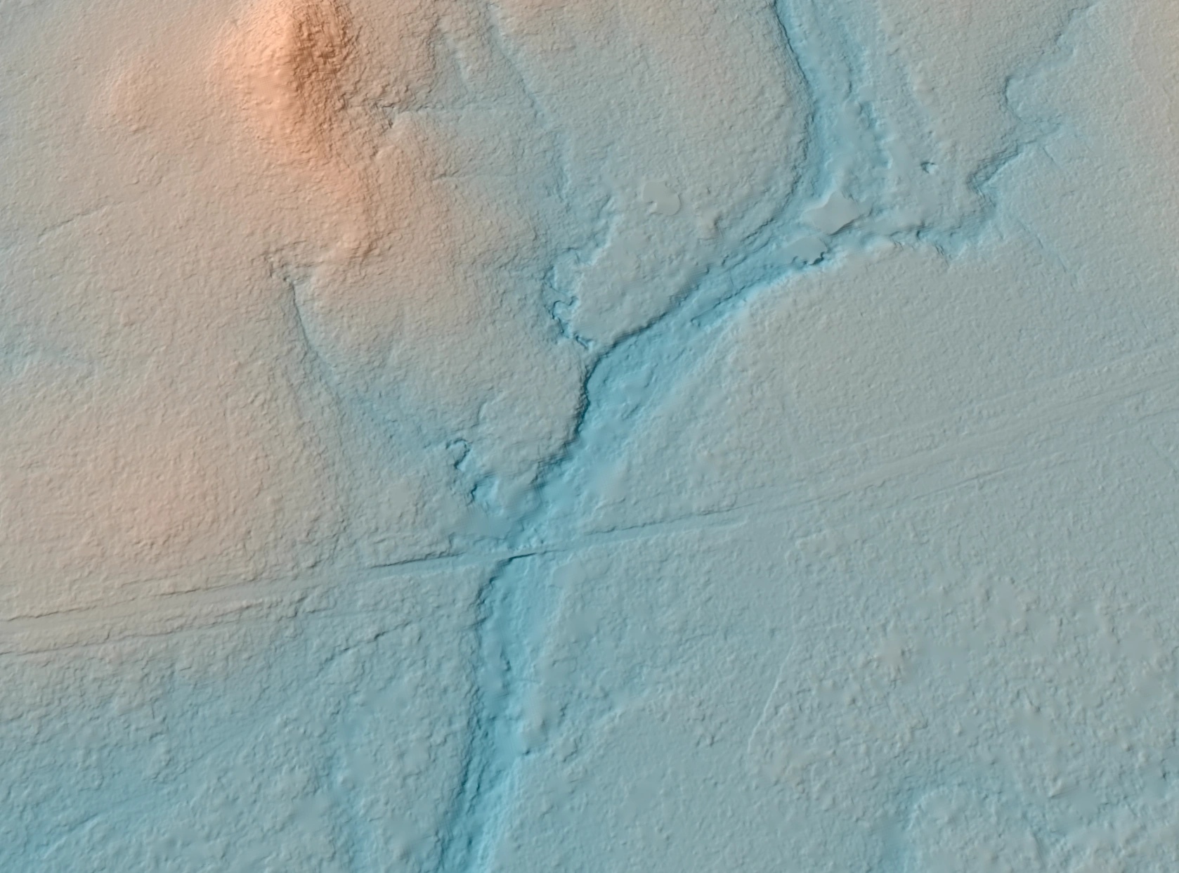 50cm satellite-derived terrain model of the same crossing, showing the creek channel, its banks and the road formation