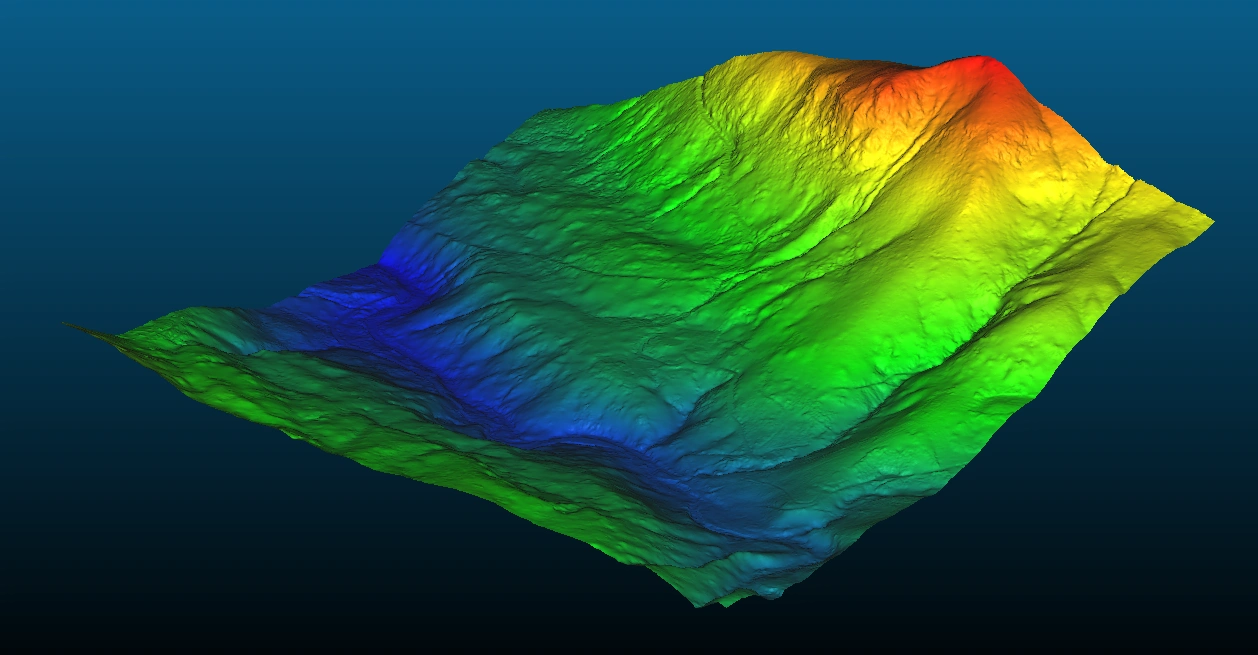 Shaded 3D bare-earth terrain mesh derived from LiDAR, colour ramped by elevation, showing a ridge and valley