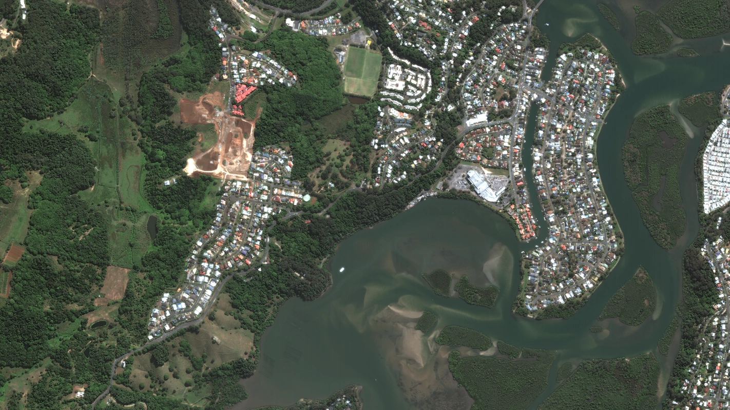 Natural colour satellite image of the Tweed estuary, New South Wales, with mangrove islands, suburbs, bushland and a construction site