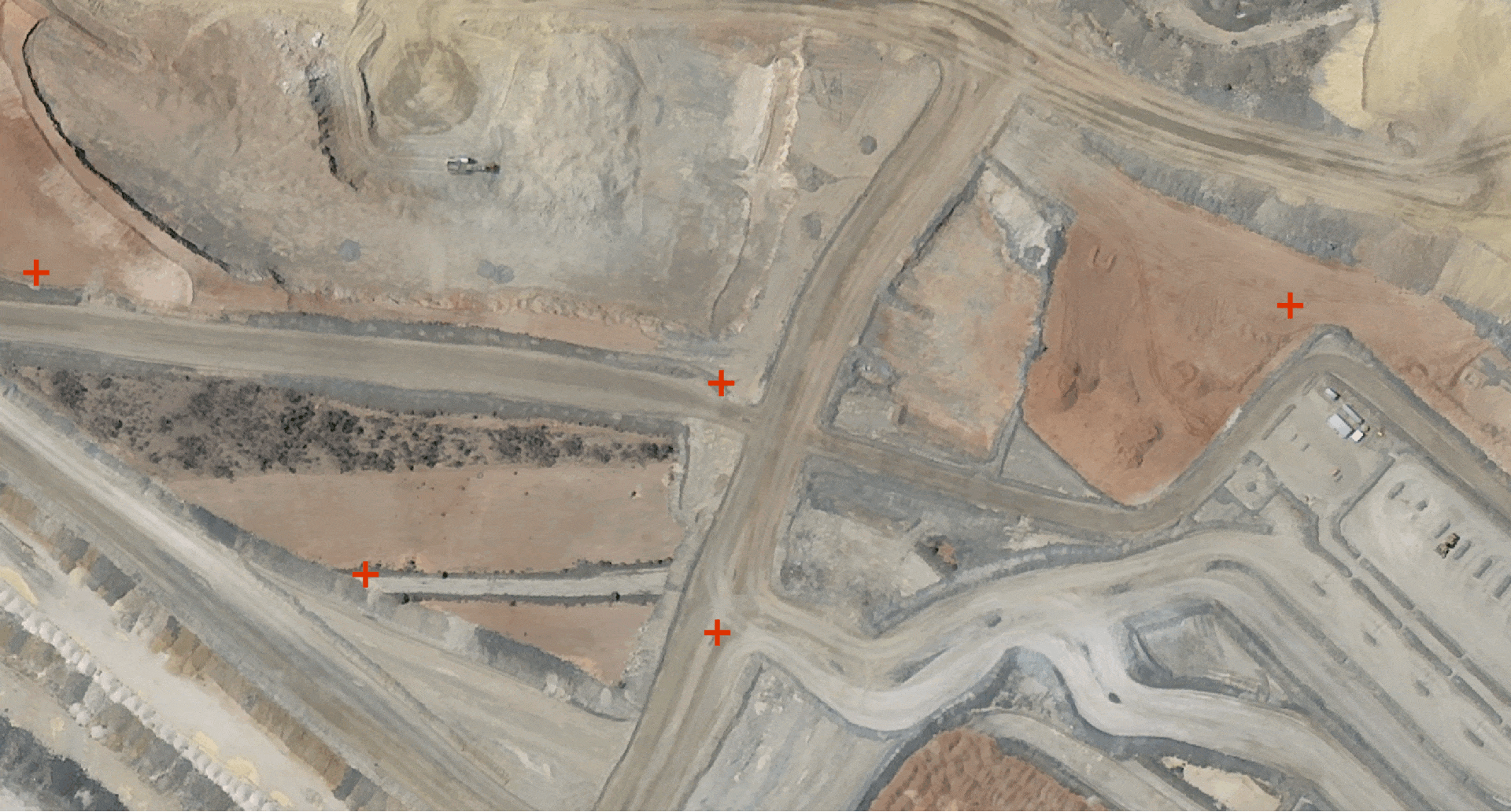 Orthorectification example: raw satellite image shift over a mine site corrected to align with ground features.